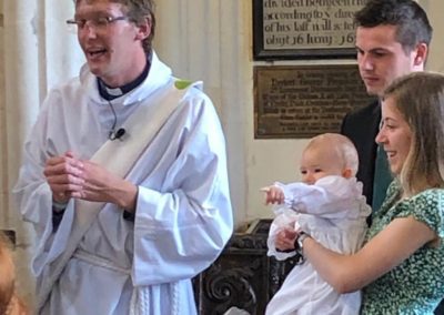 Rev Lewis Eden conducting a Baptism